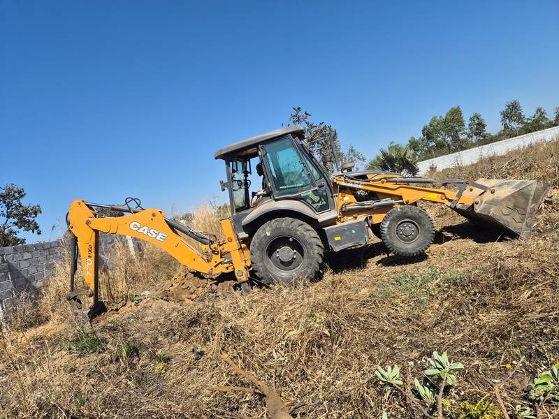 CASE TLB excavating a slope in Zambia