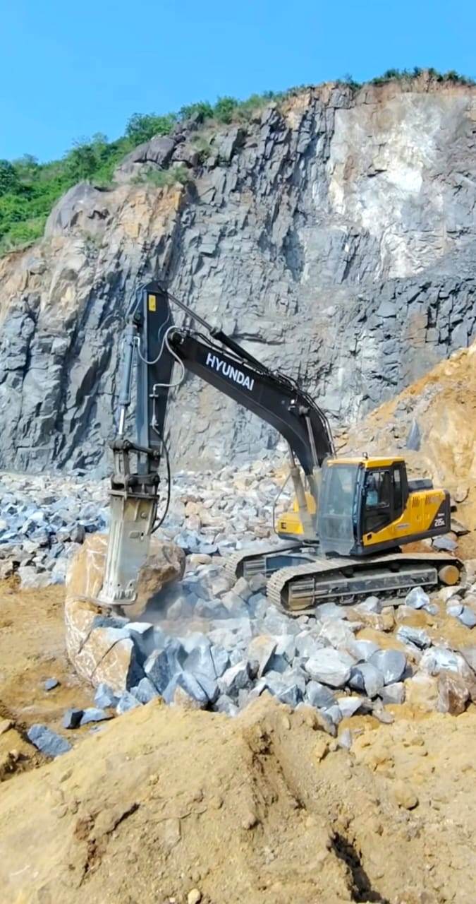 Hyundai excavator with breaker attachment in a quarry in Zambia