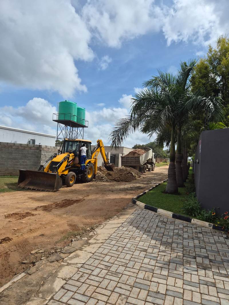 JCB TLB working at a property site in Zambia